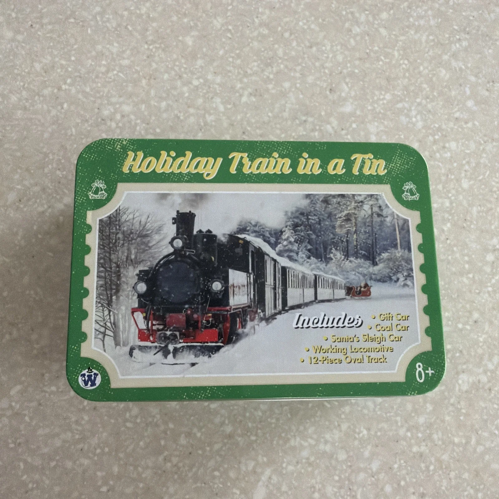 "Festive Tin Train Set with Battery-Powered Santa Claus Track"